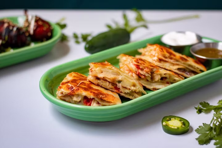 Uno Mas Tex Mex signature dishes Chicken QuesadillaTejas TacosNachos Deluxe